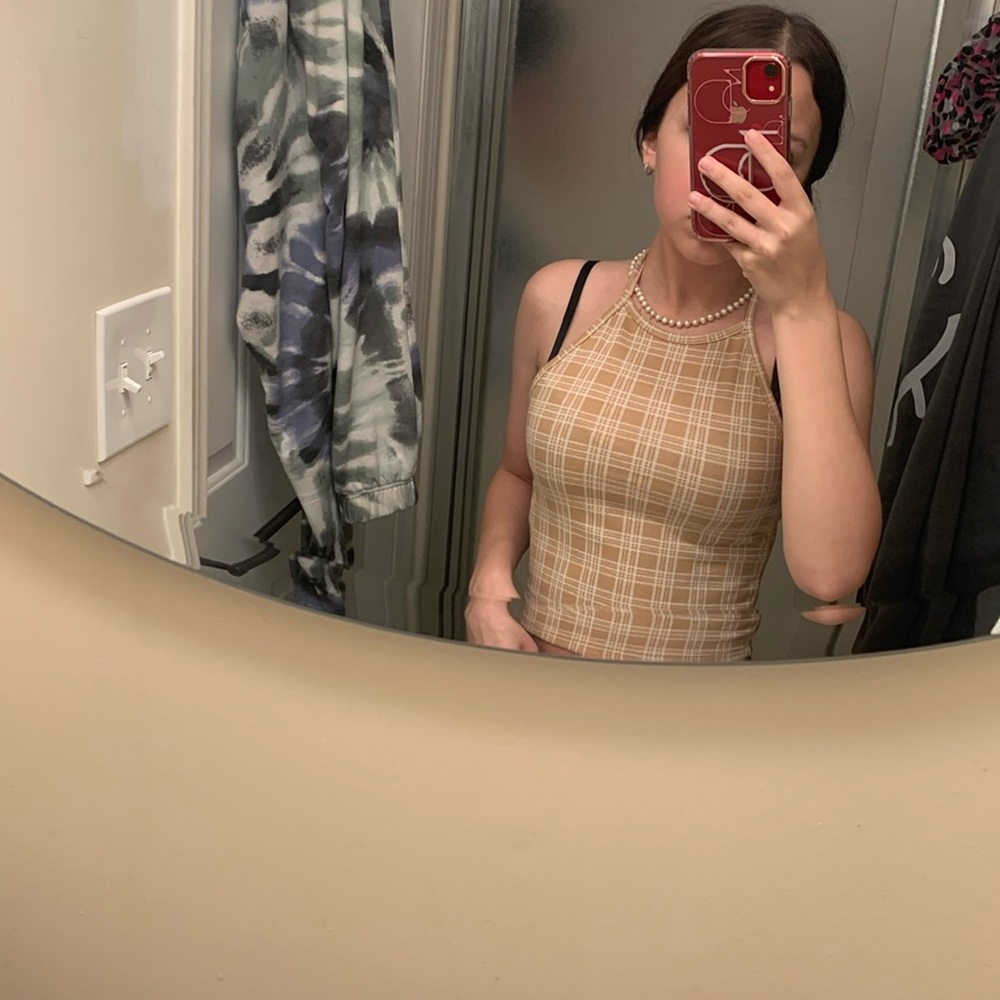 tan and white patterned tank, with open back and tie around the neck